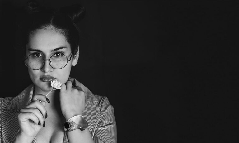 A B&W portrait of a girl looking into the camera lens