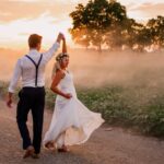 wedding photo of a couple walking in suburban road in golden hour