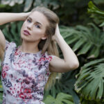 A young beautiful woman posing in frontt of camera