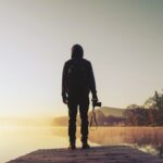 A photographer standing in front of the camera