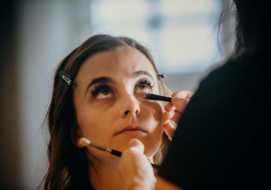 A woman getting makeup