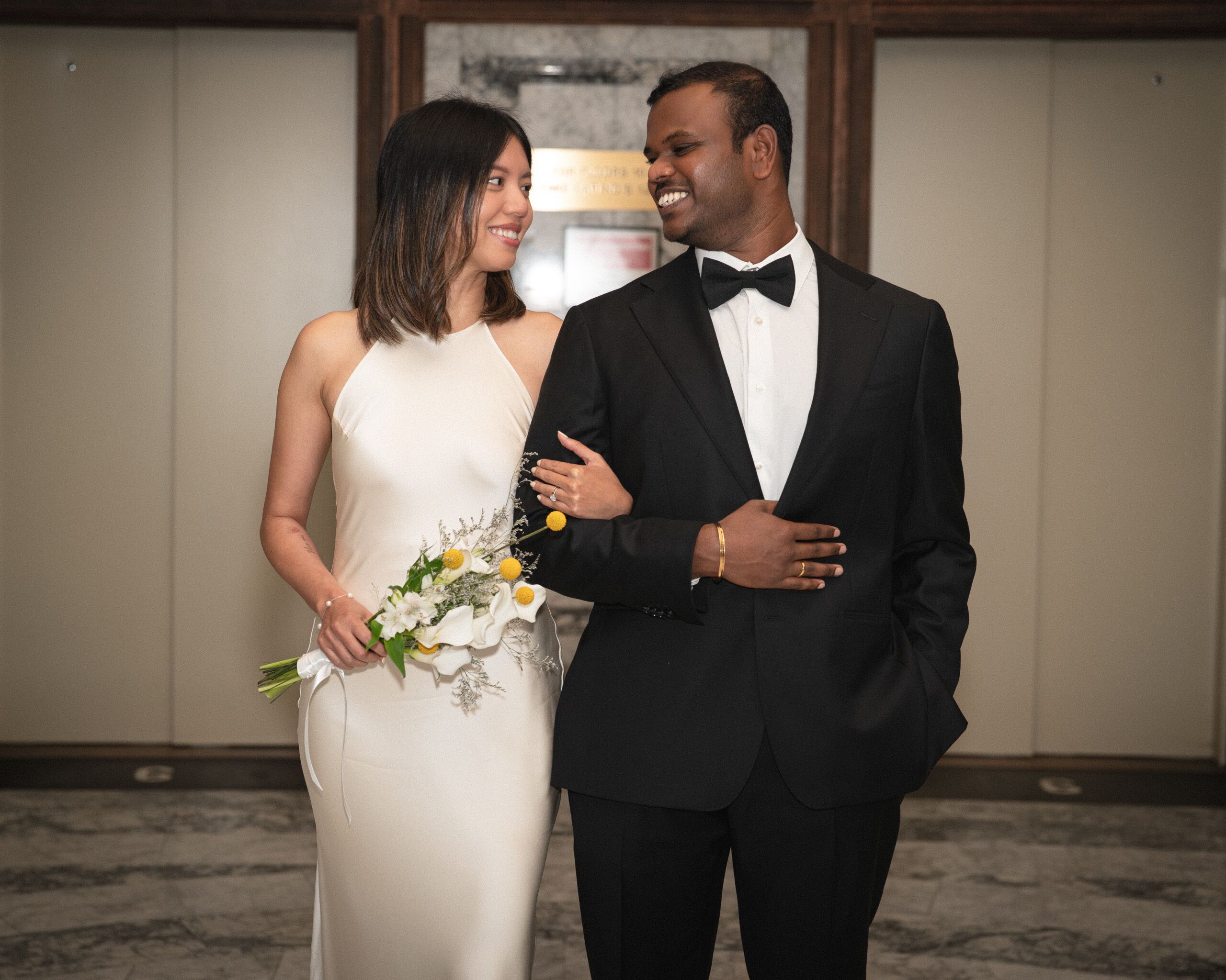 A couple posing for their wedding