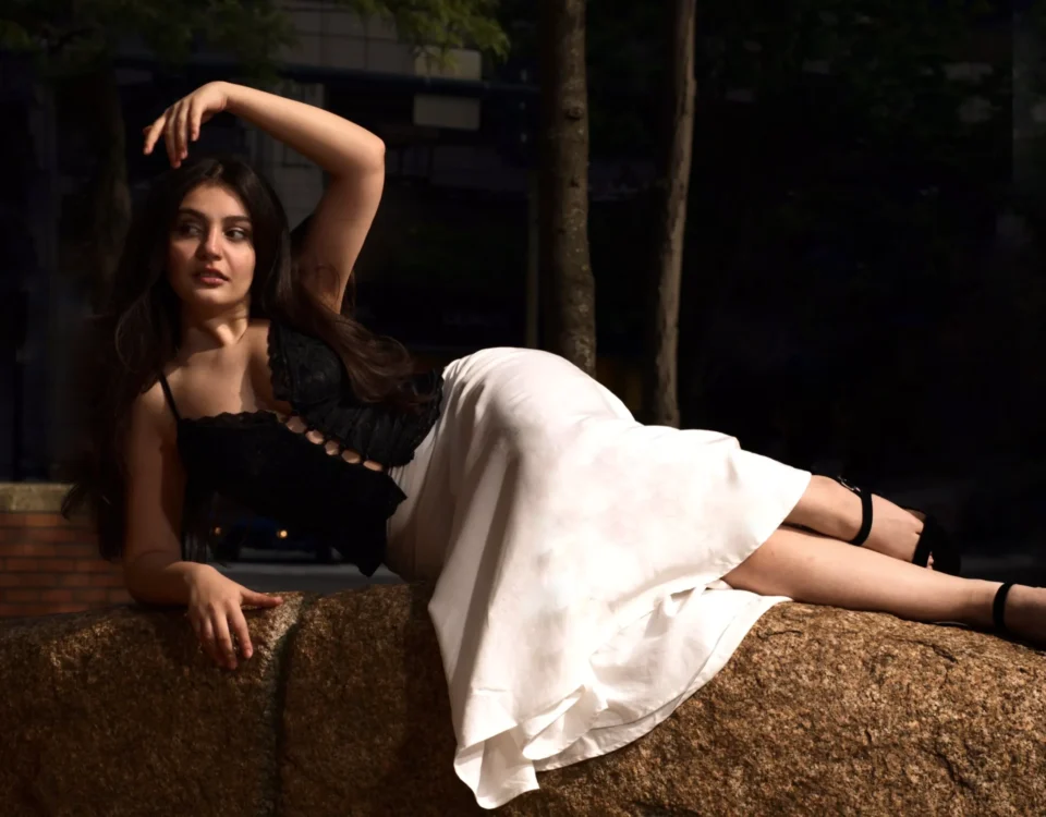 portrait of a girl lying on a rock
