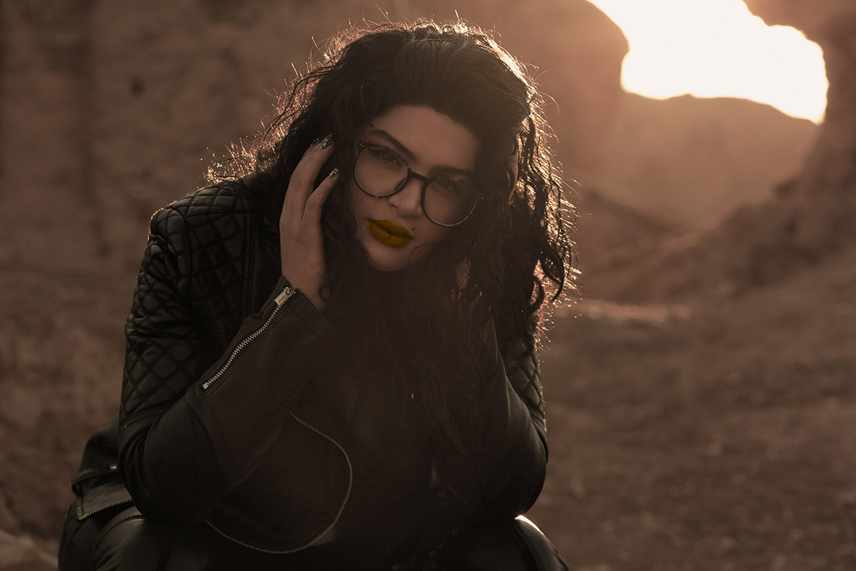 A close up portrait of a woman at sunset
