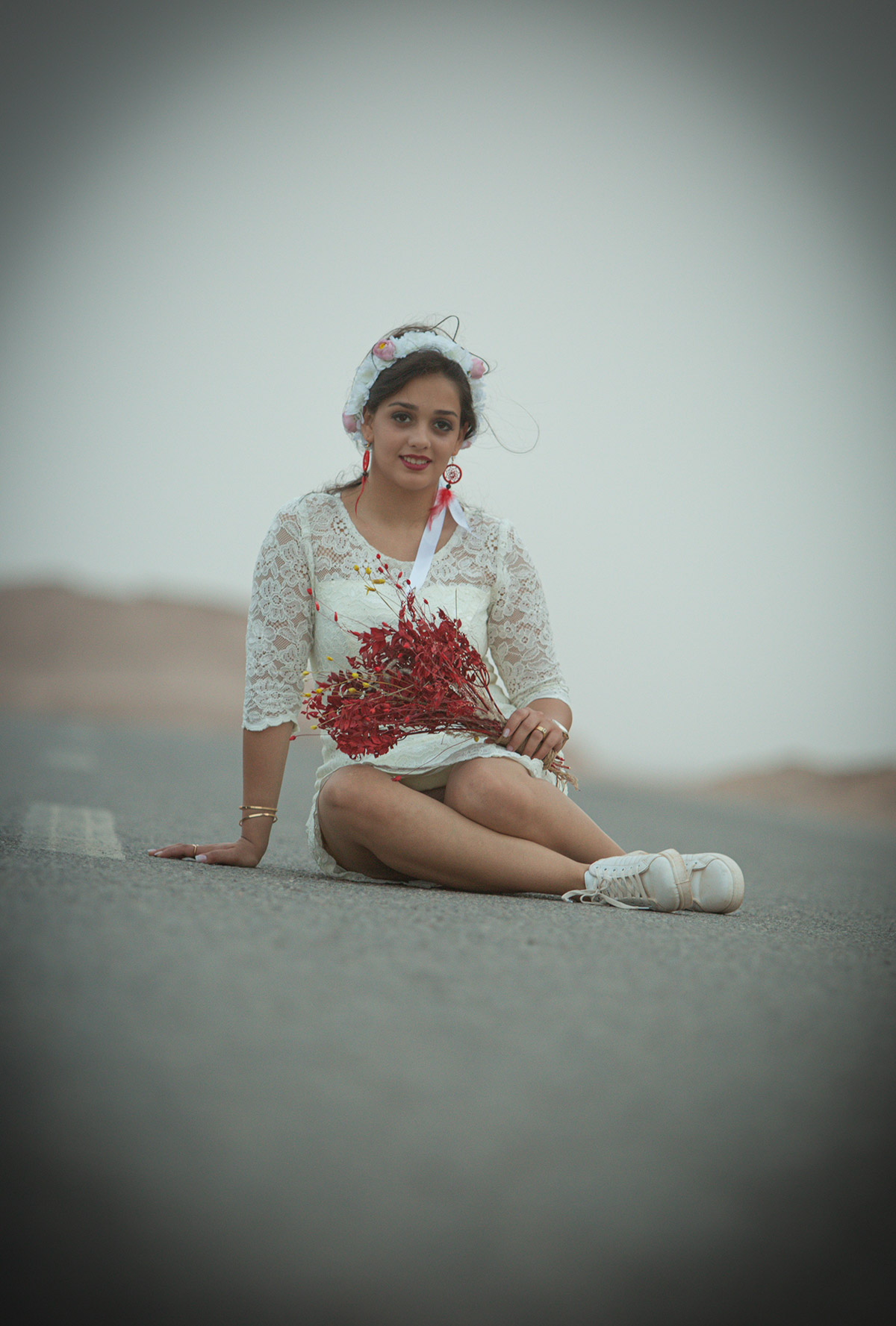 A girl holding a flower in her hand in the engagement day 