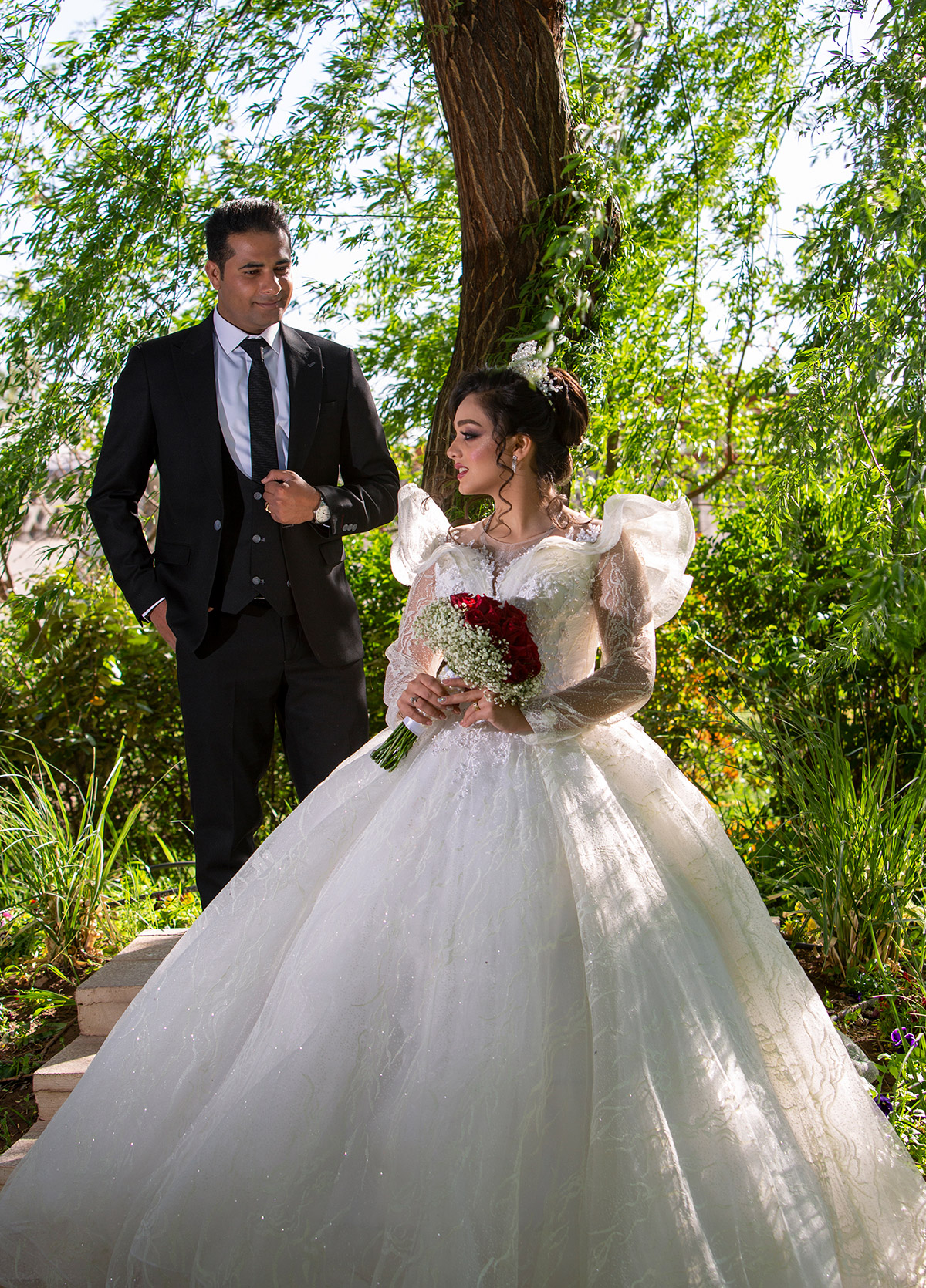 Wedding photo of a Persian couple on their wedding day with a mesmerizing pose