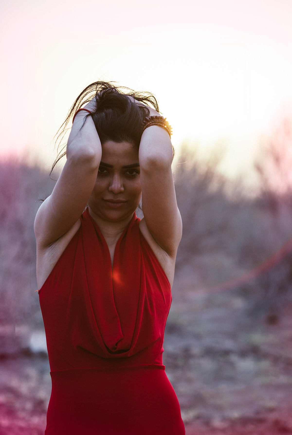 A close up portrait of a woman in red