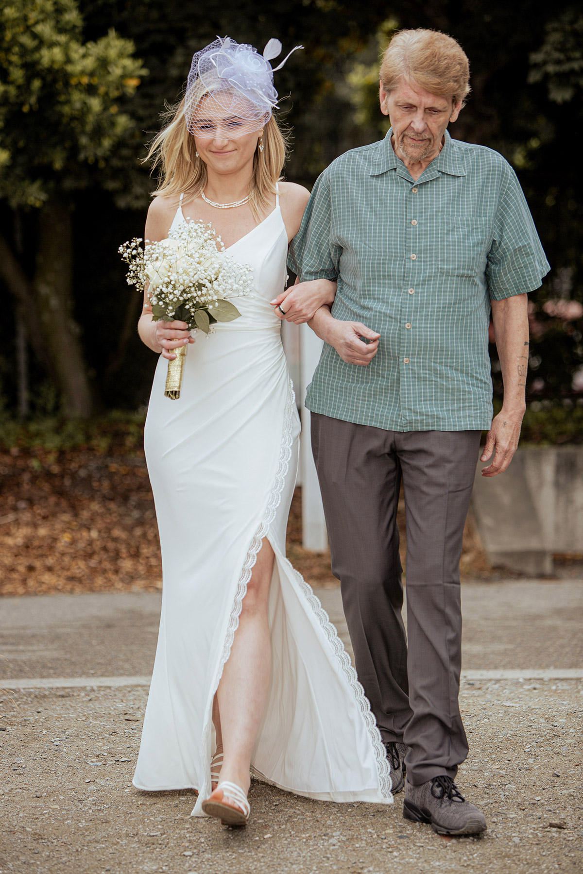 Bride walking down the aisle with his dad on her wedding day.