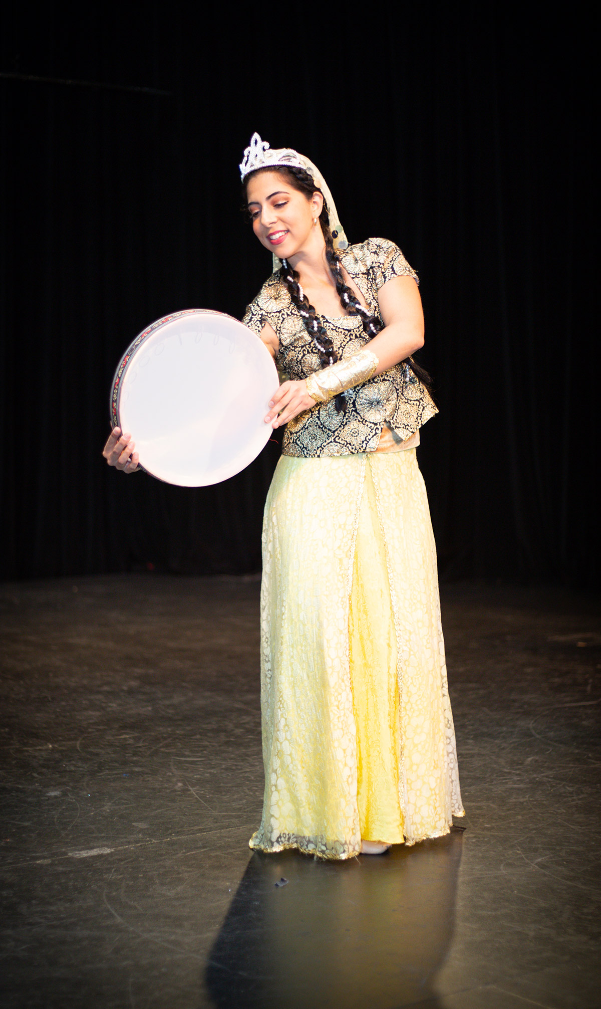 A Persian woman dancing on the stage.