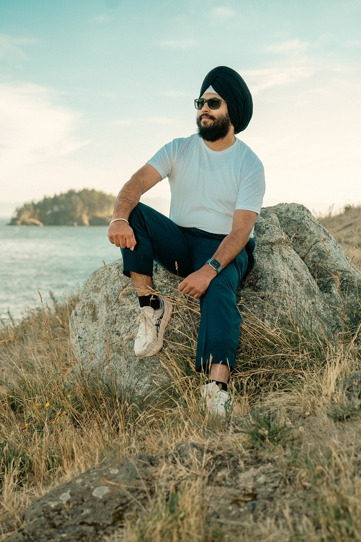 Portrait of a man sitting on a rock
