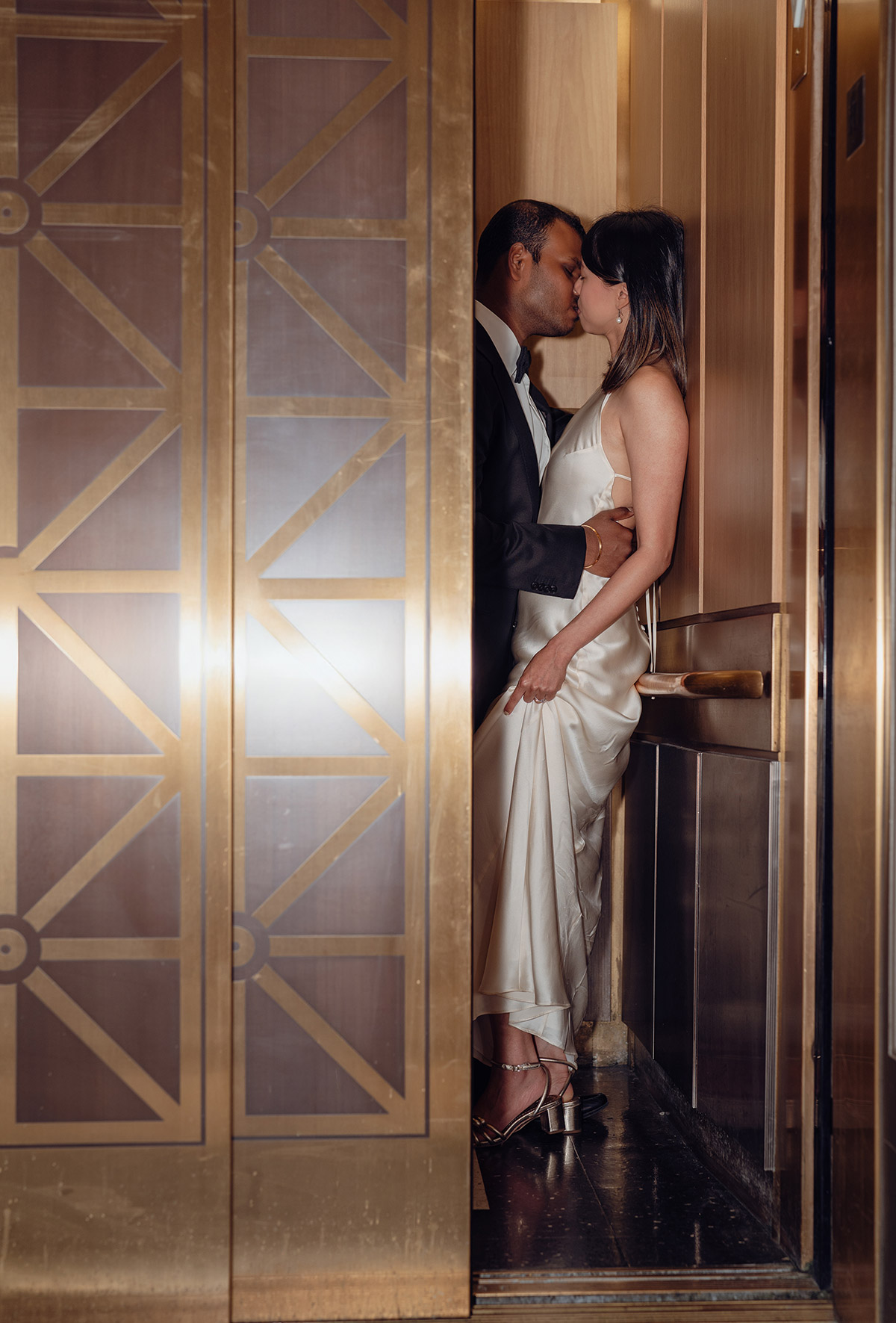 A romantic photo of a couple in the elevator