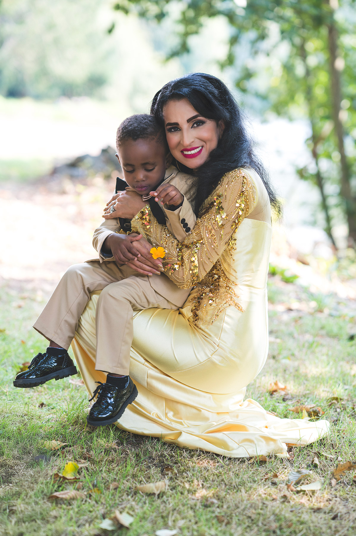 A mother holding her little roddler in her arms