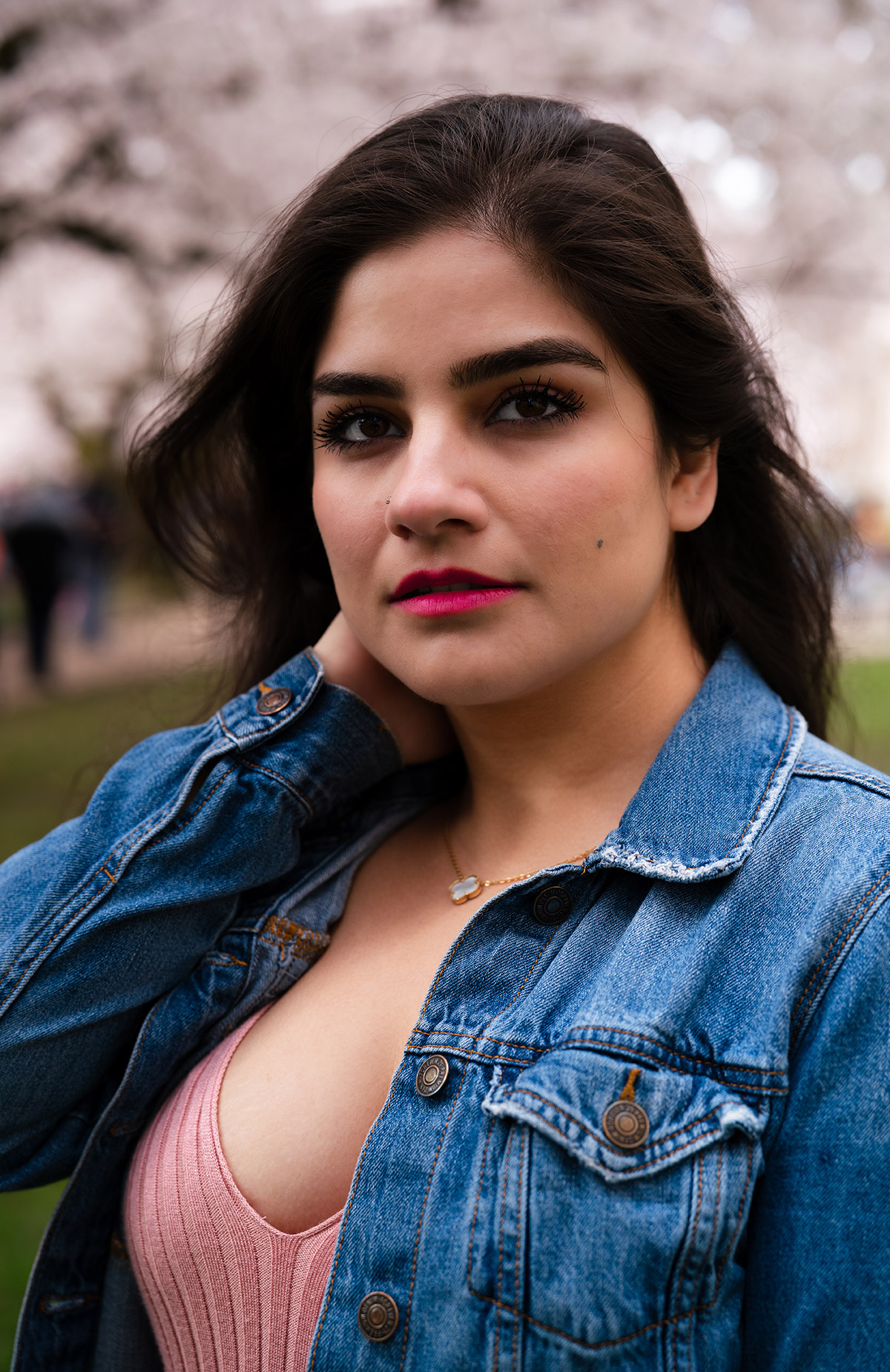 A beautiful portrait of a woman with pink outfit and jean