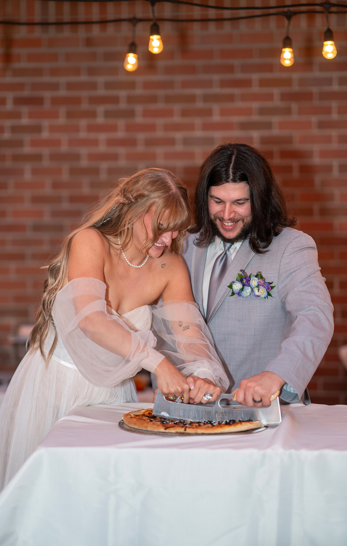 A couple with their wedding cake