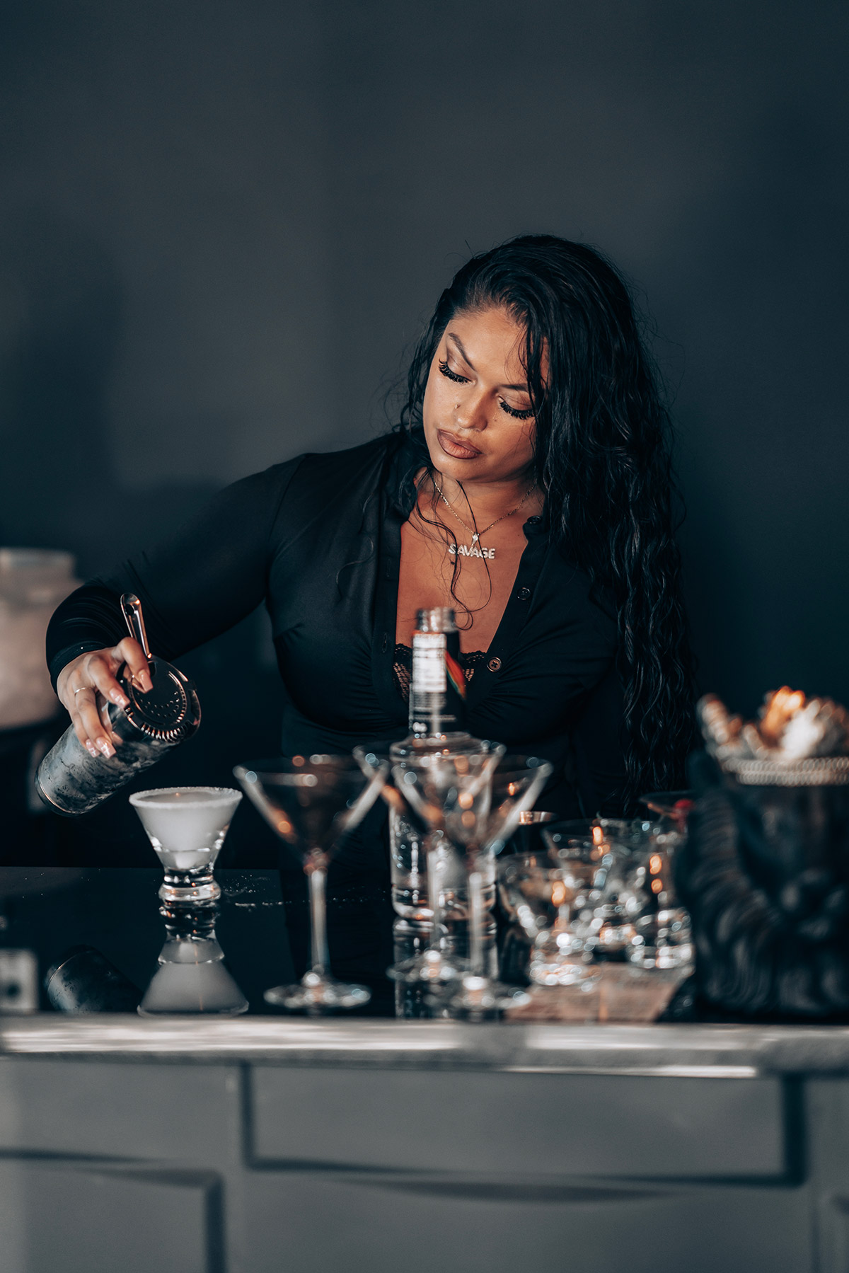 A bartender filling cups