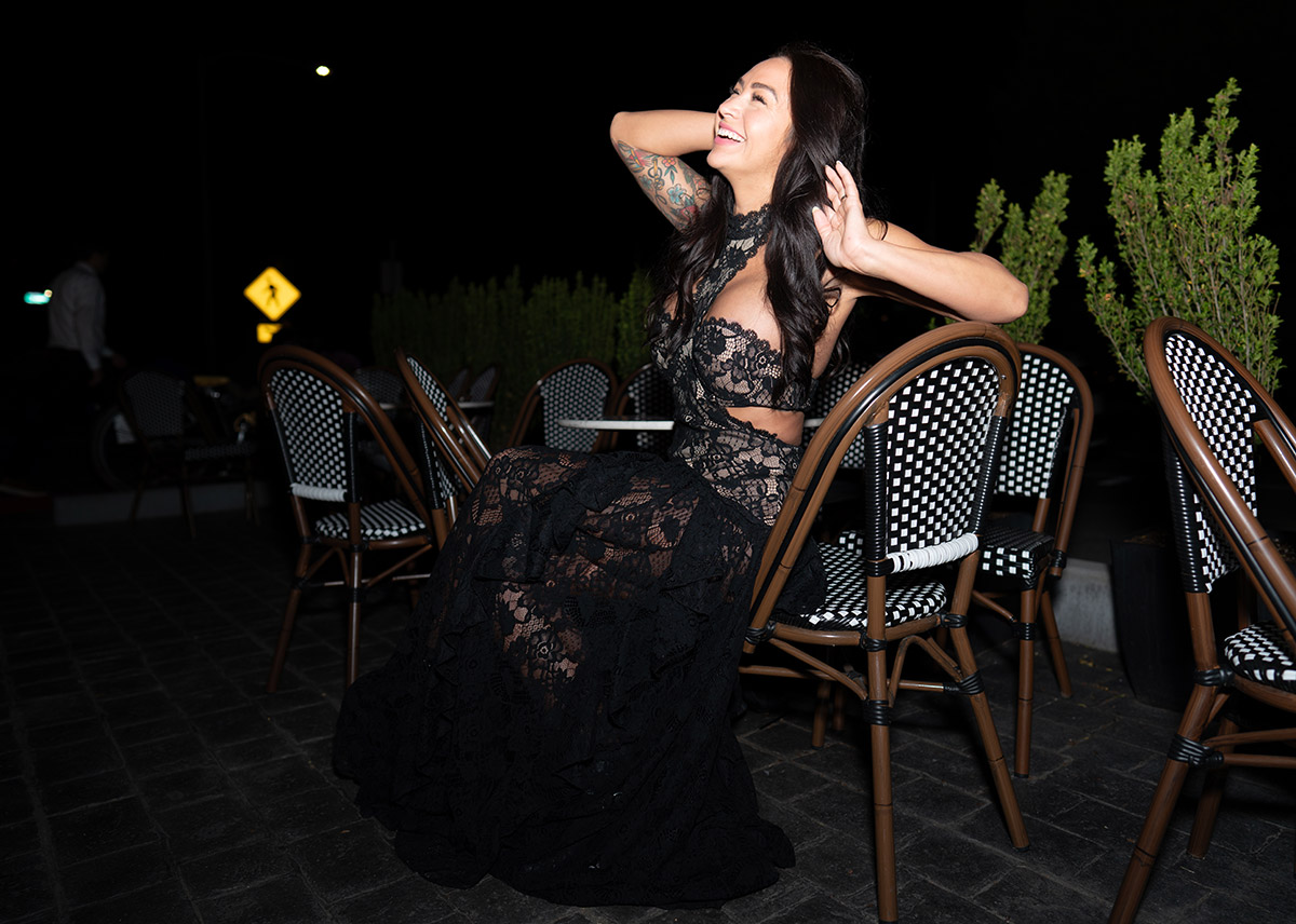 A portrait at night with professional pose and black dress