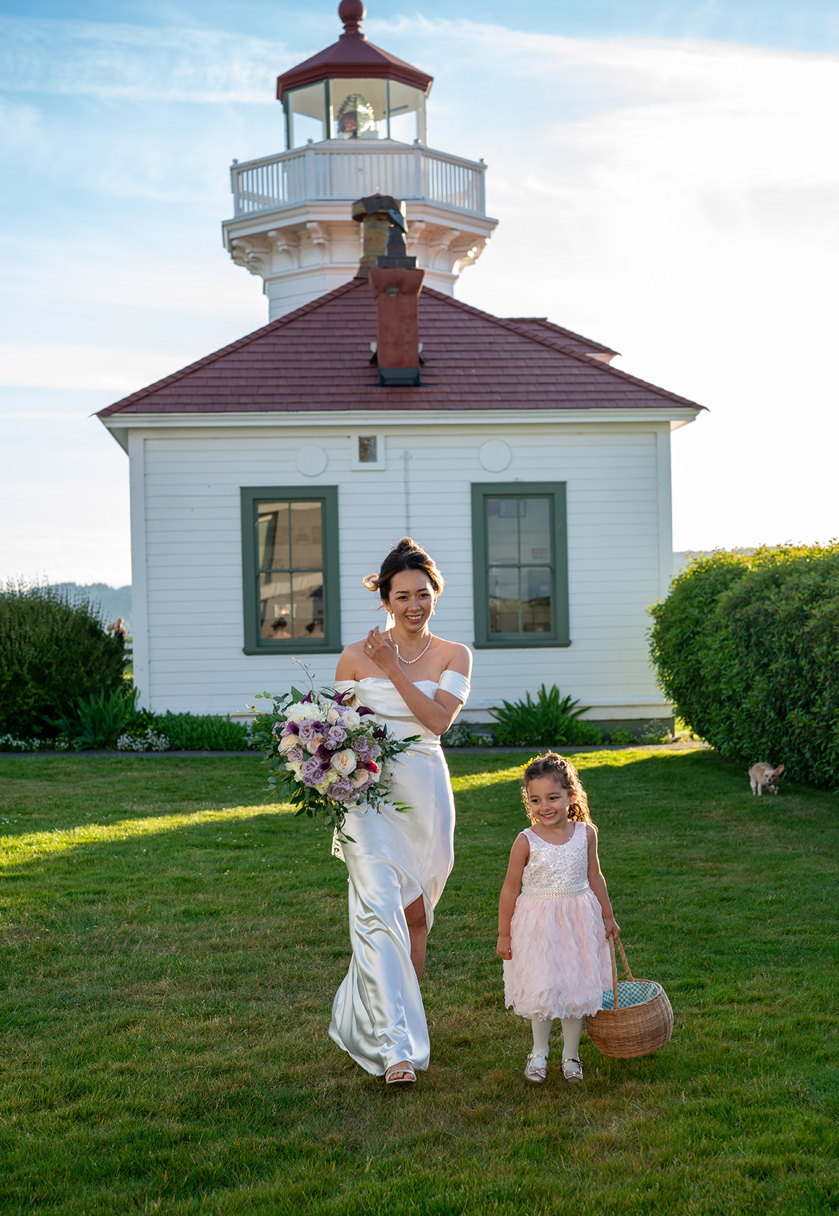 The bride is running after a kid cheerfully.
