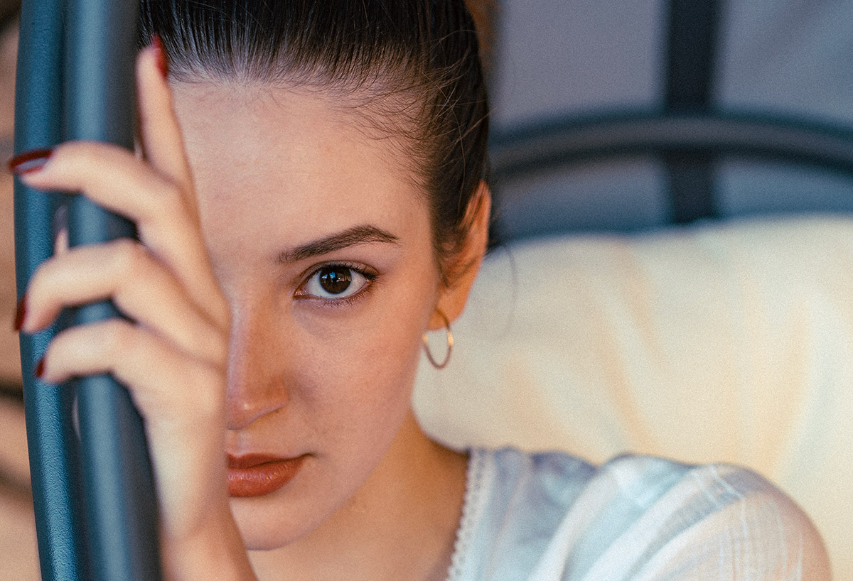 Portrait photo of a girl with her hand on her face