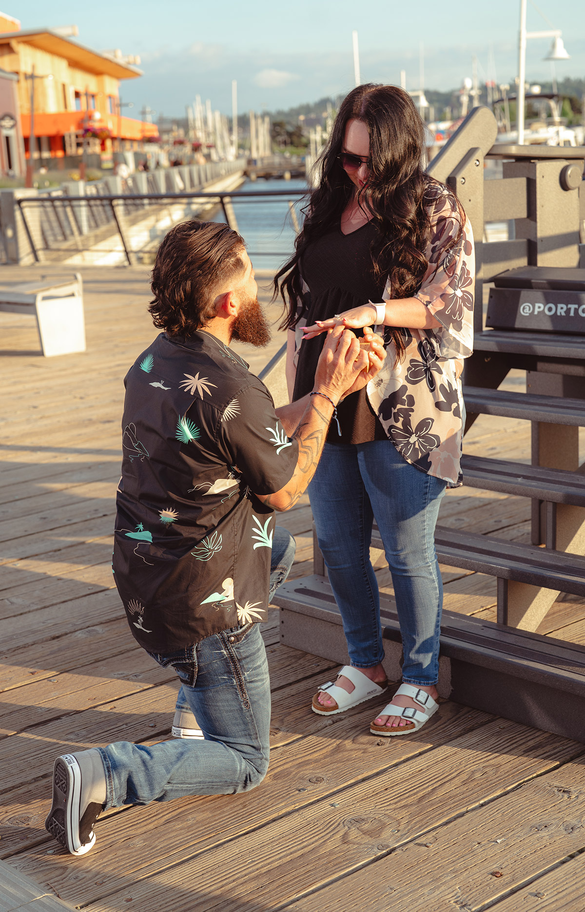 The man kneeling in front of his woman