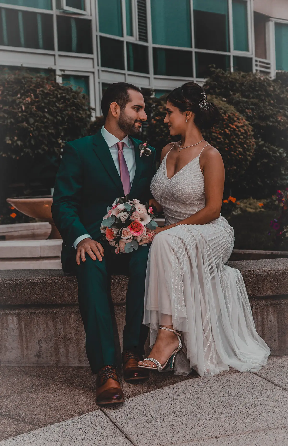A wedding photo of a couple staring at eachother's eyes